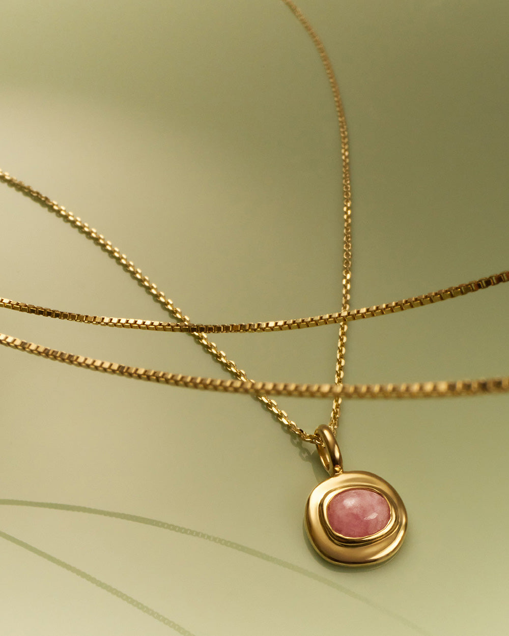 INTO THE FLOW RHODOCHROSITE CHARM (9K GOLD)